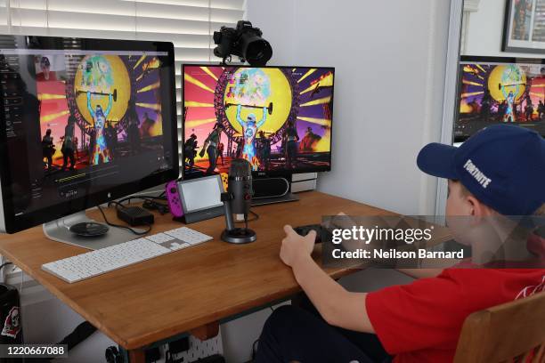 Year-old Ansel, the photographer’s son, plays Fortnite featuring Travis Scott Presents: Astronomical on April 23, 2020 in South Pasadena, California....