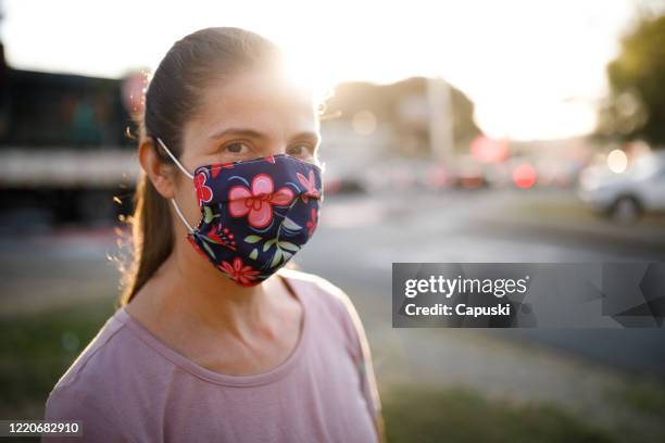 woman wearing homemade protective face mask - homemade mask stock pictures, royalty-free photos & images