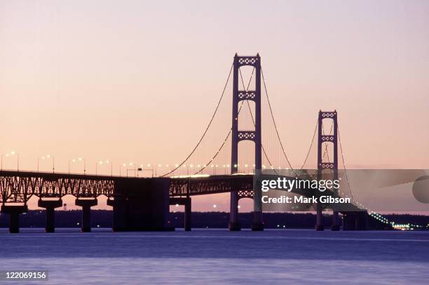 mackinac bridge at dusk, michigan - mackinac island stock-fotos und bilder