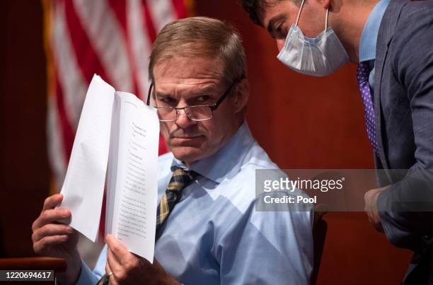 Ranking Member Jim Jordan speaks to an aid during a House Judiciary Committee markup of H.R. 7120, the "George Floyd Justice in Policing Act of...