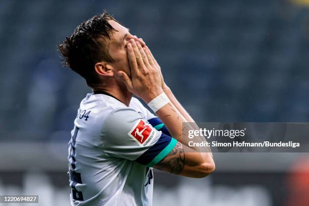 Bastian Oczipka of Schalke is disappointed during the Bundesliga match between Eintracht Frankfurt and FC Schalke 04 at Commerzbank-Arena on June 17,...
