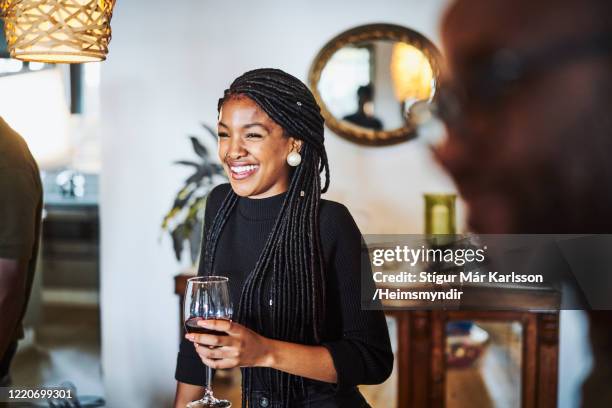 smiling woman looking away while having wine - south africa wine stock pictures, royalty-free photos & images