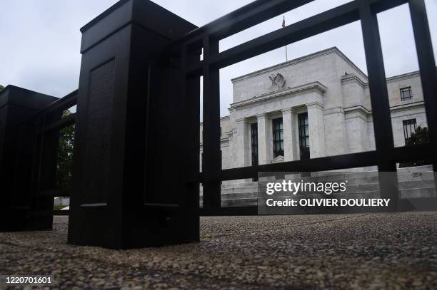 The Federal Reserve Building is seen through a fence on June 17, 2020 in Washington, DC.