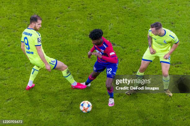 Ahmet Engin of MSV Duisburg, Boubacar Barry of KFC Uerdingen 05 and Migel-Max Schmeling of MSV Duisburg battle for the ball during the 3. Liga match...