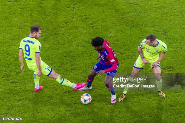 Ahmet Engin of MSV Duisburg, Boubacar Barry of KFC Uerdingen 05 and Migel-Max Schmeling of MSV Duisburg battle for the ball during the 3. Liga match...