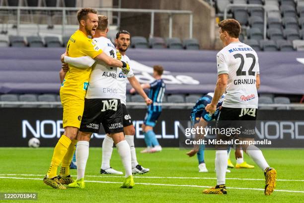 Oscar Jansson goalkeeper for Orebro SK celebrates their 2-1 victory with teammates Michael Almeback and Albin Granlund during an Allsvenskan match...