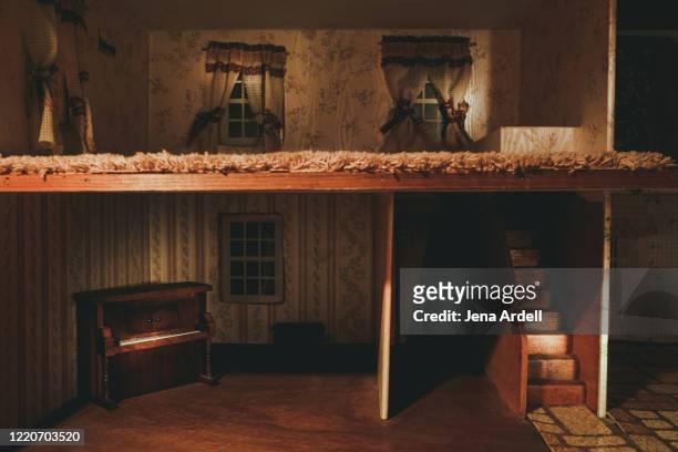 dollhouse: conceptual image for home security, foreclosure and the housing market crisis - dollhouse stockfoto's en -beelden