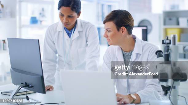 who knows what we'll discover today - pathologist stock pictures, royalty-free photos & images