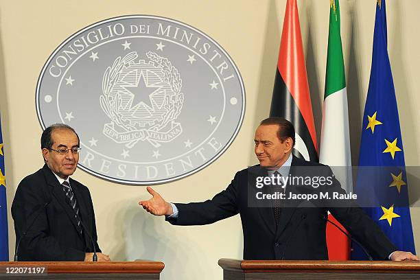Deputy chairman of the National Transitional Council Executive Board Mahmoud Jibril and Italian Prime Minister Silvio Berlusconi attend a meeting and...