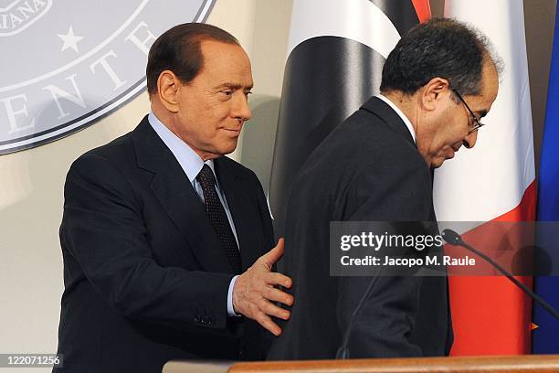Italian Prime Minister Silvio Berlusconi and Deputy chairman of the National Transitional Council Executive Board Mahmoud Jibril attend a meeting and...