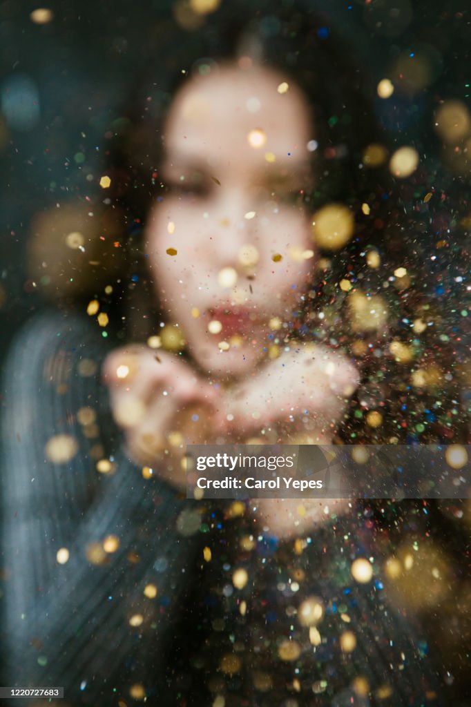 Blowing golden sparkles