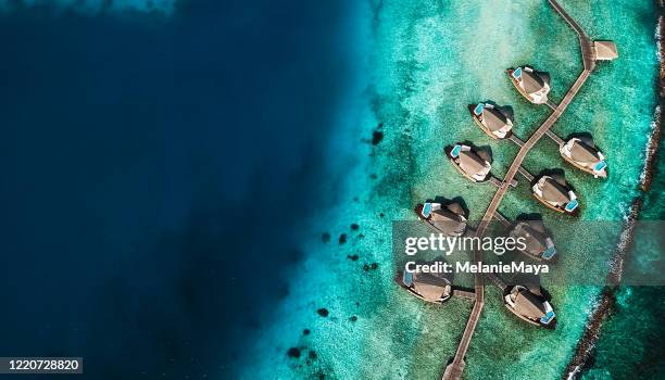 maldives island lagoon with water villas - private beach stock pictures, royalty-free photos & images