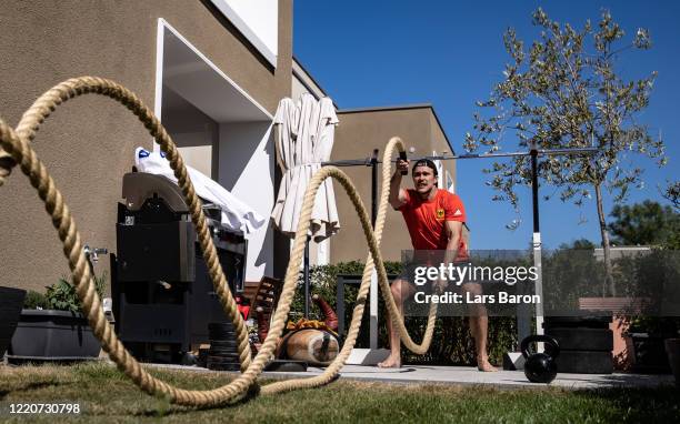 Judoist Alexander Wieczerzak trains in the garden of his apartment on April 23, 2020 in Cologne, Germany. The World Champion from 2017 trains at home...
