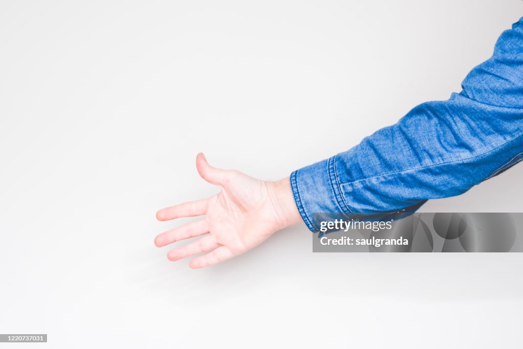 Man's hand on light background