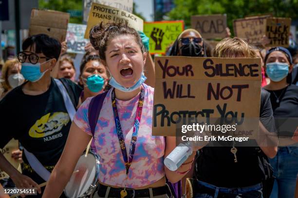 Participant holding a Your Silence Will Not Protect You sign at the protest. Hundreds of Brooklynites joined LGBTQ Youth at Barclays Center for a...