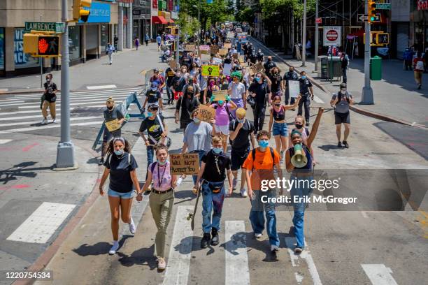 The large crowd of LGBTQ youth marching through Downtown Brooklyn. Hundreds of Brooklynites joined LGBTQ Youth at Barclays Center for a march across...