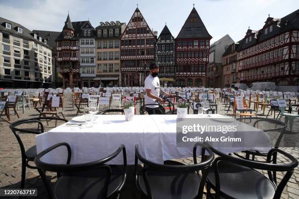 Restaurant chairs stand during a nationwide protest by restaurateurs during the novel coronavirus crisis at the Roemer place on April 24, 2020 in...