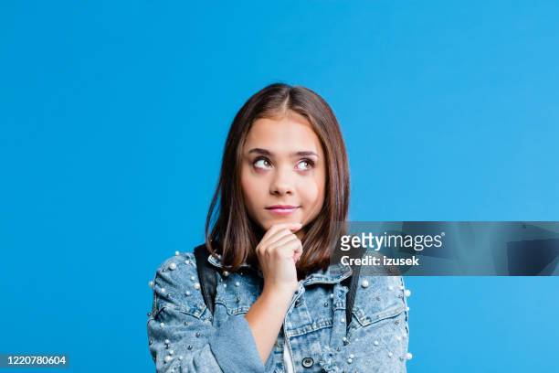 portrait of pensive teenege girl - contemplation stock pictures, royalty-free photos & images