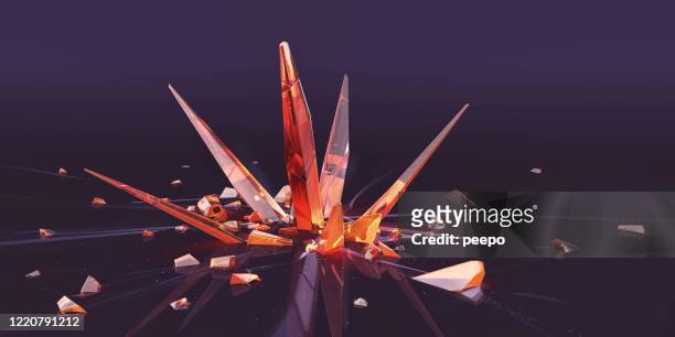 spiky orange crystal shards surrounded by smaller shattered fragments - crystal stock pictures, royalty-free photos & images
