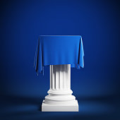Сolumn covered with blue cloth. Isolated on a blue background with clipping path.