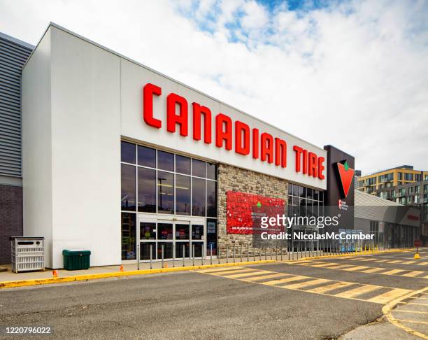 canadian tire store facade oblique view - canadian culture stock pictures, royalty-free photos & images