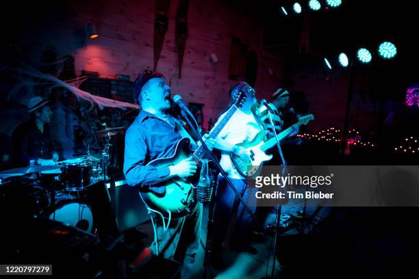 rock band performing in a garage bar - lead singer imagens e fotografias de stock
