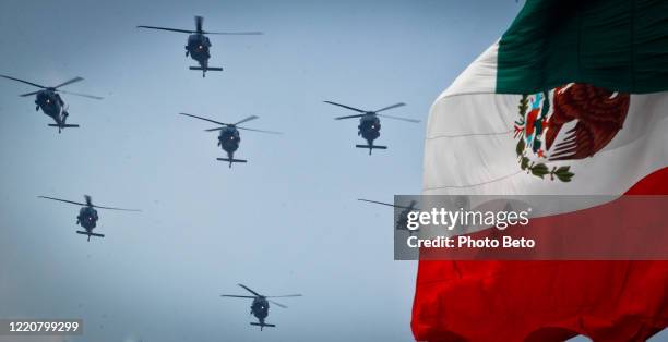 a flock of helicopters during the independence day military parade in mexico city - national day military parade 2012 stock pictures, royalty-free photos & images