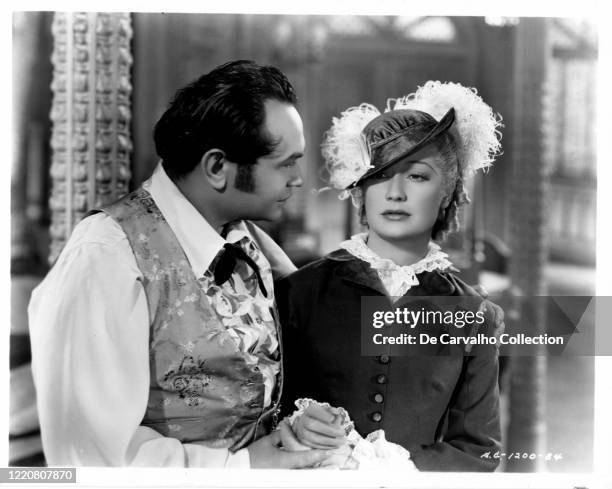 Edward G Robinson as 'Luis Chamalis' and Miriam Hopkins as 'Mary Swan Rutledge' in a publicity shot from the movie 'Barbary Coast' United States.