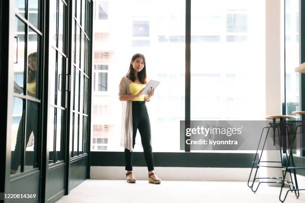 young woman is telecommuting - job centre stock pictures, royalty-free photos & images