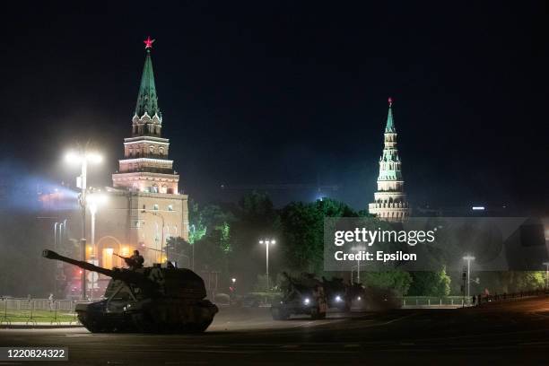 Military vehicles move past Kremlin after a rehearsal of a military parade in Red Square marking the 75th anniversary of the Victory in WWII on June...