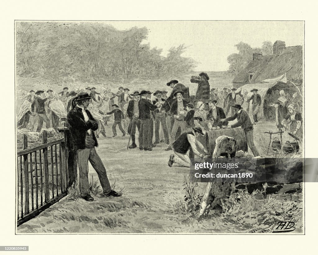Locals drinking and dancing at a traditional French festival