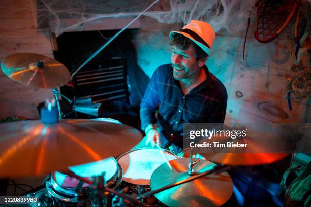 rock band performing in a garage bar - lead singer stock pictures, royalty-free photos & images