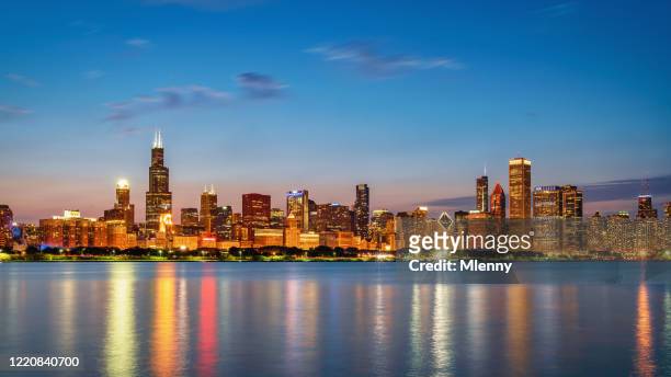 chicago city panorama lake michigan reflections at twilight - illinois stock-fotos und bilder