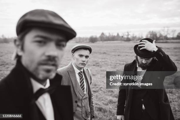 monochrome of boys posing and looking at camera. - 1910 stock-fotos und bilder