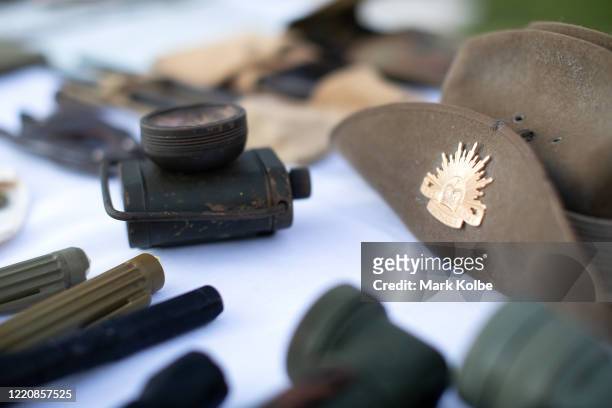 Lantern and an Australian Army slouch hat are seen is display during a front yard ANZAC Day ceremony in Wattle Grove on April 25, 2020 in Sydney,...