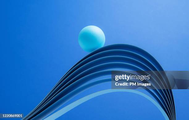 ball riding paper wave - business strategy abstract stock pictures, royalty-free photos & images