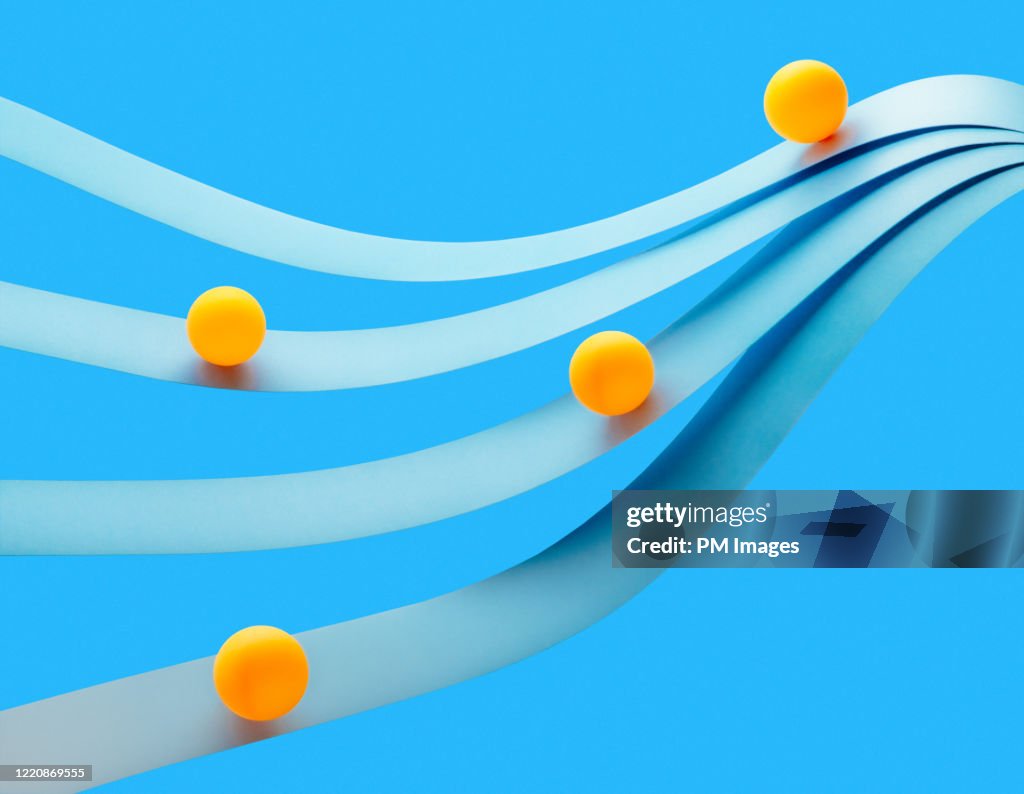 Balls riding paper waves