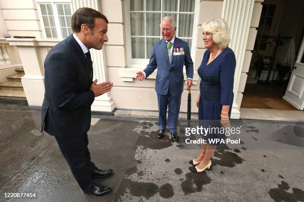 Prince Charles, Prince of Wales and Camilla, Duchess of Cornwall greet French President Emmanuel Macron with a namaste gesture as he arrives at...