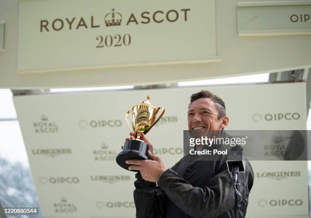 Frankie Dettori celebrates with the trophy after riding Stradivarius to win his third Gold Cup during Day Three of Royal Ascot 2020 at Ascot...