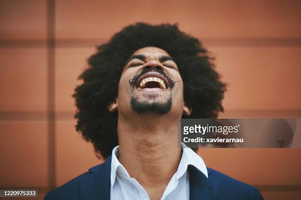 portrait of joyful afro-caribbean businessman in early 30s - head back stock pictures, royalty-free photos & images