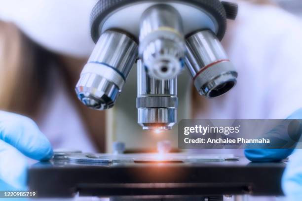 close up picture of microscope in the laboratory - laboratorium stockfoto's en -beelden