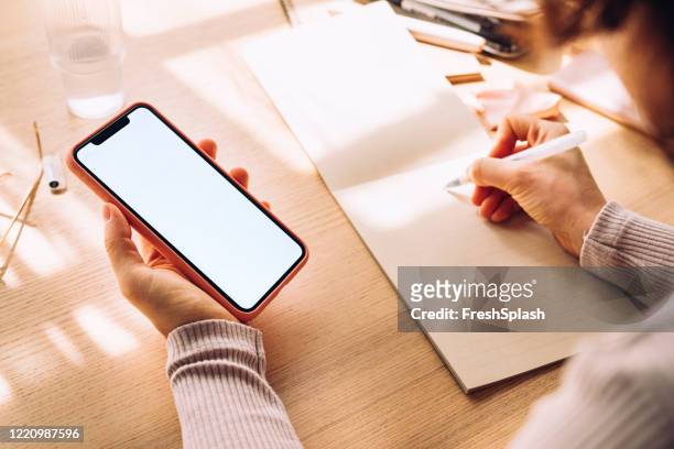 hands of a woman using a mobile phone with a blank screen (copy space), a close up - writing copy stock pictures, royalty-free photos & images