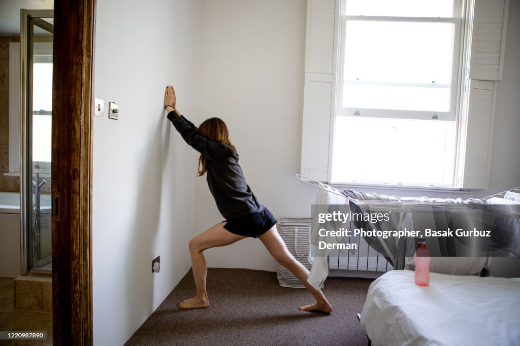 A woman exercising at home