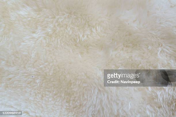 sheepskin carpet texture - wool stock pictures, royalty-free photos & images