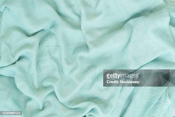 green wrinkled bedsheets - ミントグリーン ストックフォトと画像