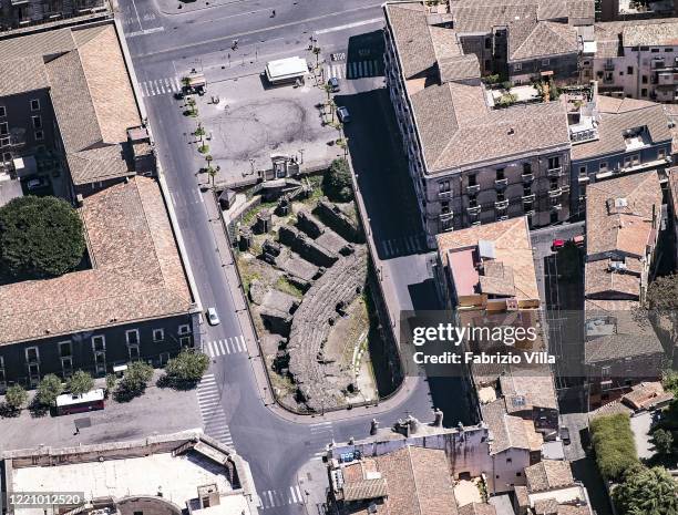 Aerial view of the empty Roman amphitheater in Piazza Stesicoro from a Catania Coast Guard helicopter flight on April 25, 2020 in Catania, Italy. The...