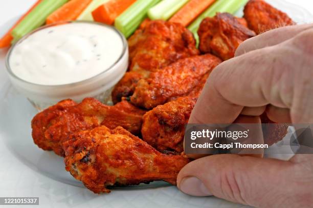 buffalo chicken wing appetizer plate with blue cheese dipping sauce - hand chicken wing stock pictures, royalty-free photos & images