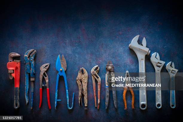 aged construction hand tools inventory pliers nippers, wrenches, grip, pipe wrench - knolling tools stock pictures, royalty-free photos & images