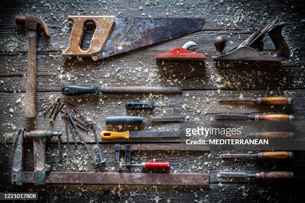 carpenter hand tools vintage rusty as hammer, chisels, bar clamp, files, saw, brush - knolling tools stock pictures, royalty-free photos & images