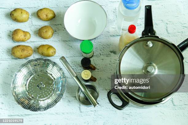 preparing to make mashed potatoes - pressure cooker stock pictures, royalty-free photos & images